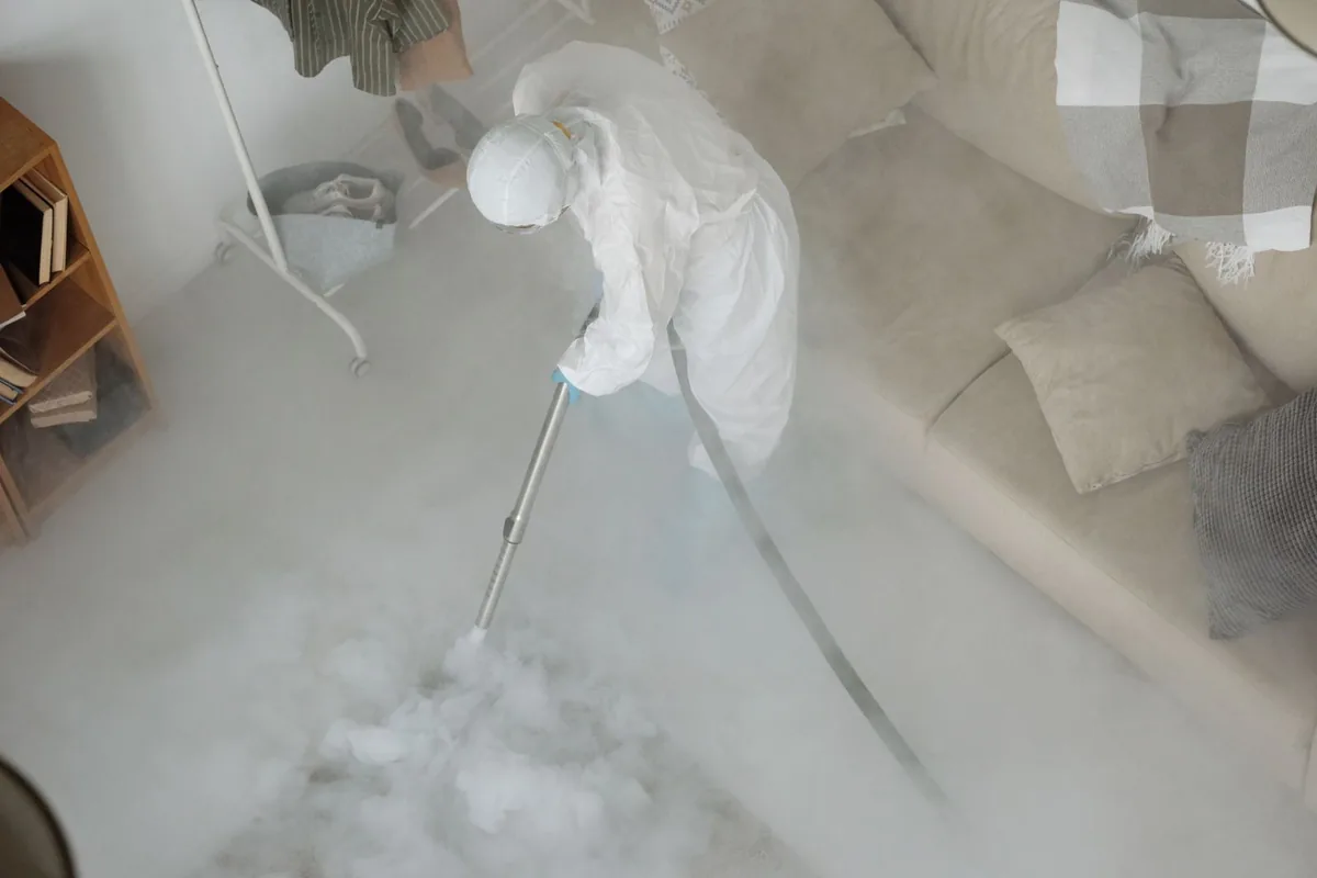 Biohazard cleanup technician in protective equipment, Portage Lakes, OH